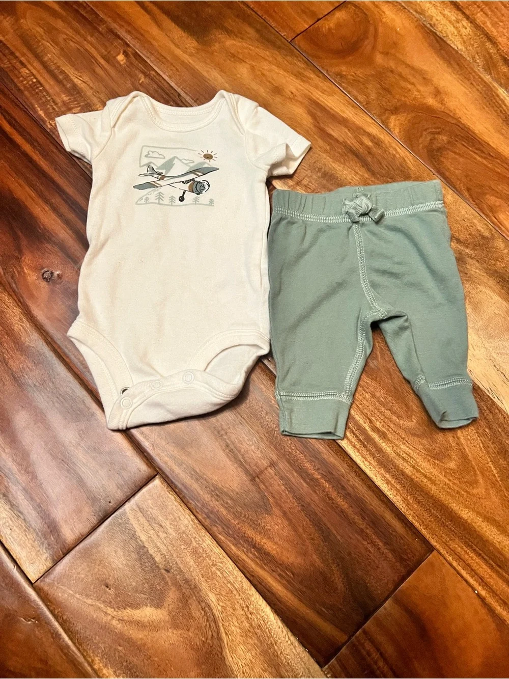 Baby boy carter’s newborn airplane outfit.